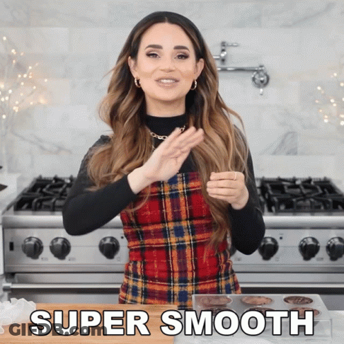 Woman In Plaid Dress Standing By Stove GIF