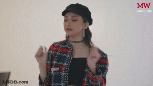 Woman In Plaid Jacket And MW Hat GIF