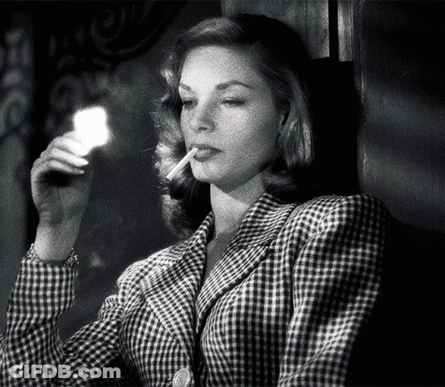 Woman In Plaid Jacket Lighting Cigarette GIF