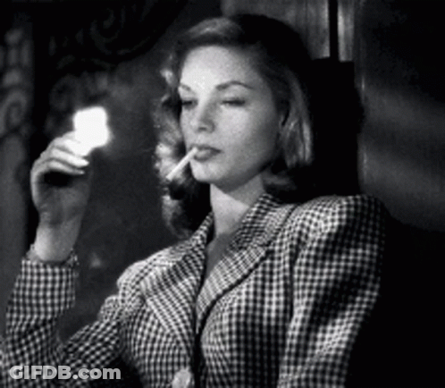 Woman In Plaid Jacket Smoking Cigarette Holding Flashlight GIF