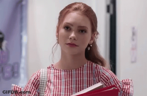 Woman In Plaid Shirt Holding Folder GIF