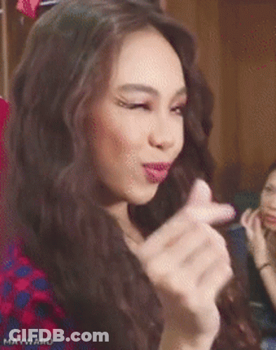 Woman In Plaid Shirt Making Funny Face GIF