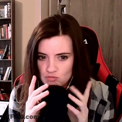 Woman In Plaid Shirt On Red Chair Number 1 GIF