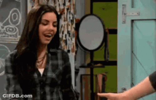 Woman In Plaid Shirt Pointing At Man GIF
