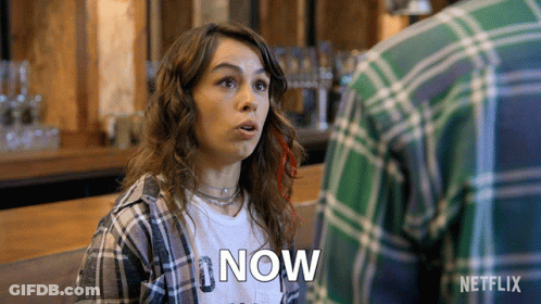 Woman In Plaid Shirt Saying Now GIF