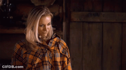 Woman In Plaid Shirt Standing By Sign You Are Thriving Girl GIF
