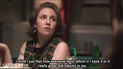 Woman In Plaid Shirt Talking To Another Woman GIF