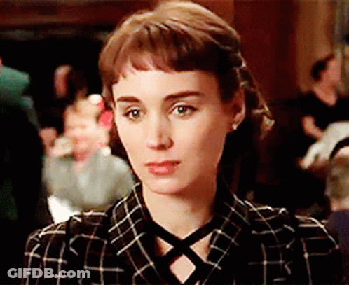 Woman In Plaid Shirt With Crisscross Neckline GIF