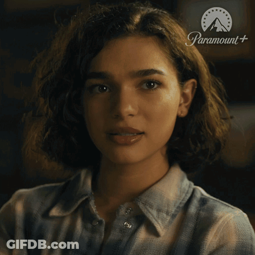 Woman In Plaid Shirt With Paramount Logo GIF