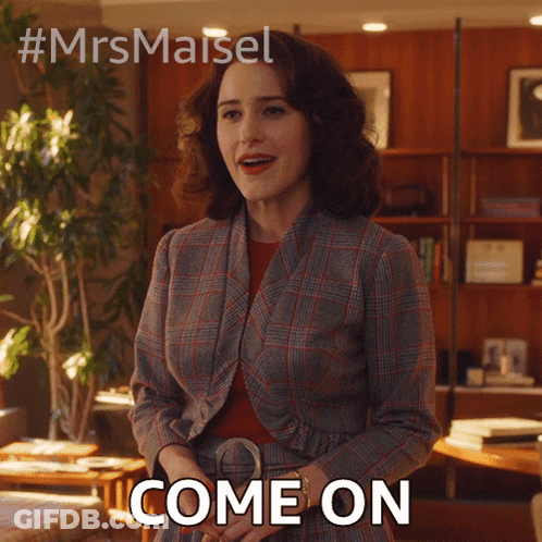 Woman In Plaid Suit Standing In Room Says Come On GIF