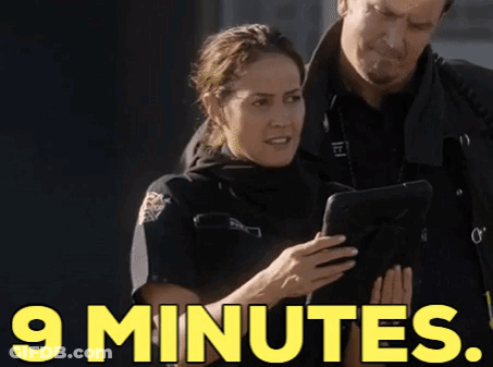 Woman In Police Uniform And Man Looking At Tablet GIF