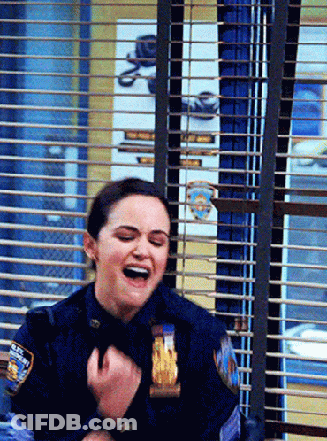 Woman In Police Uniform Laughing Behind Window GIF