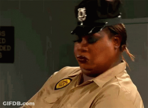 Woman In Police Uniform Making Funny Face GIF