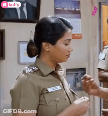 Woman In Police Uniform Standing Next To Man GIF