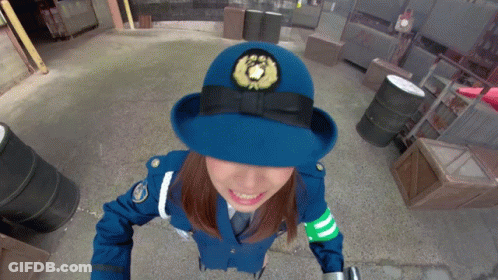 Woman In Police Uniform With Lion Emblem On Hat GIF