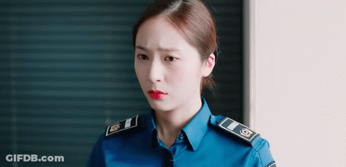 Woman In Police Uniform With Red Lipstick GIF