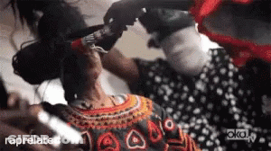 Woman In Polka Dot Dress Getting Hair Done GIF