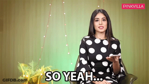 Woman In Polka Dot Dress Holding Phone GIF