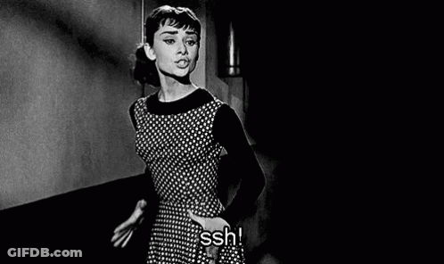 Woman In Polka Dot Dress In Dark Room GIF