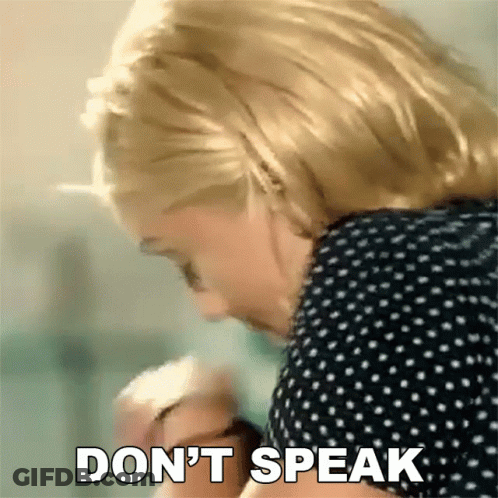 Woman In Polka Dot Shirt Says Don't Speak GIF