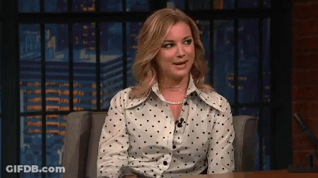 Woman In Polka Dot Shirt Sitting GIF