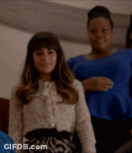 Woman In Polka Dot Shirt Smiling GIF