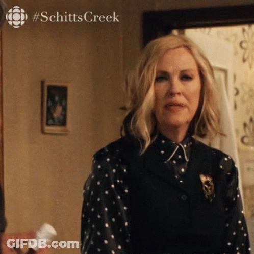 Woman In Polka Dot Shirt With Schitts Creek GIF