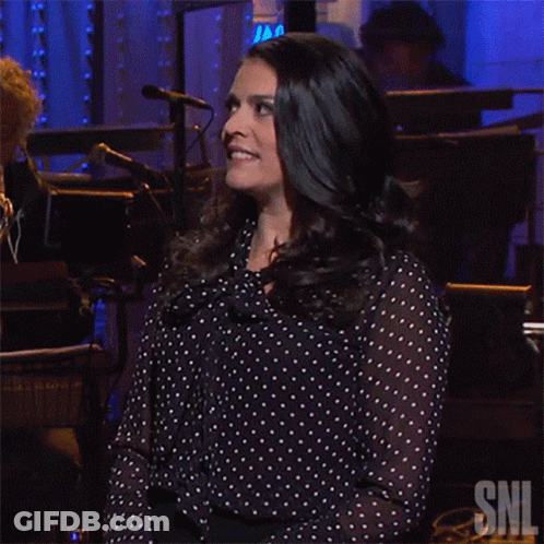 Woman In Polka Dot Shirt With SNL Logo GIF