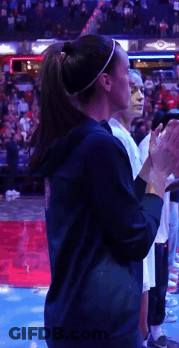 Woman In Ponytail Applauding Basketball Game GIF