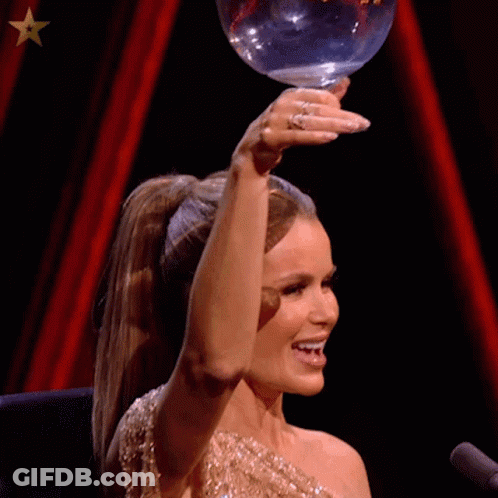 Woman In Ponytail Holding Glass And Smiling GIF