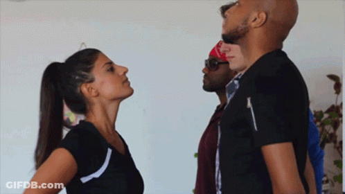 Woman In Ponytail Looking Up At Man In Black Shirt GIF
