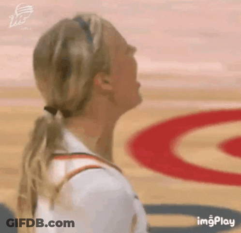 Woman In Ponytail Looking Up On Basketball Court GIF