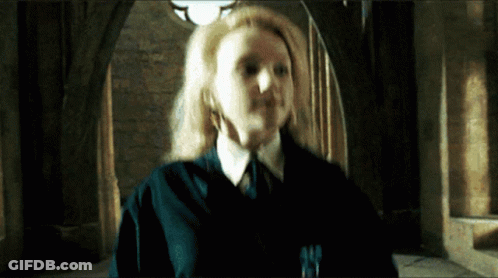 Woman In Ponytail With Head In Hands On Soccer Field GIF