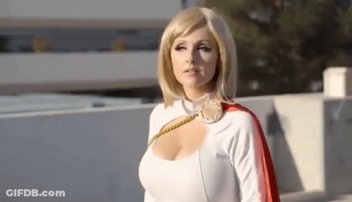 Woman In Power Girl Costume On Rooftop GIF