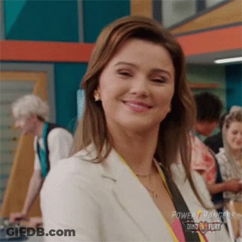 Woman In Power Rangers Uniform Smiling GIF