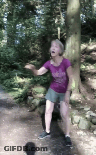 Woman In Purple Adidas Shirt Dancing In Woods GIF