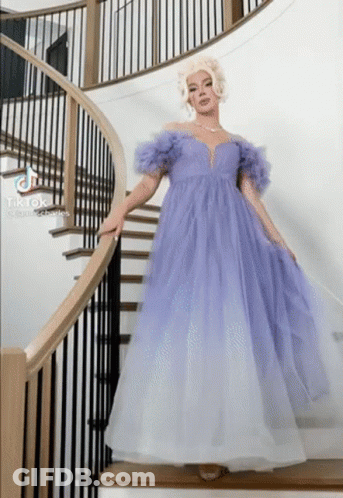 Woman In Purple And White Dress On Stairs GIF