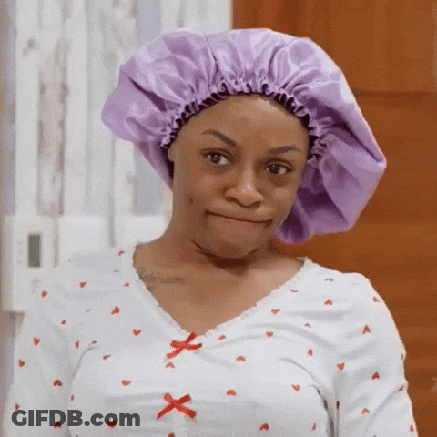 Woman In Purple Bonnet And Shirt With Hearts GIF