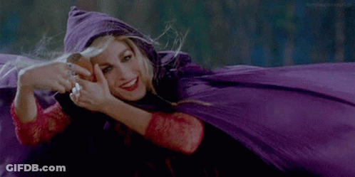 Woman In Purple Cape Smiling While Laying Down GIF