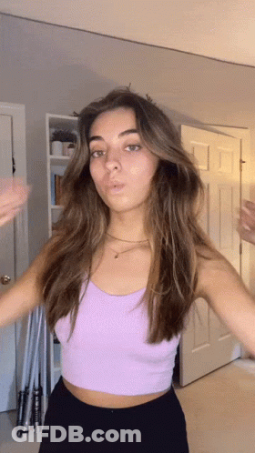 Woman In Purple Crop Top Standing GIF
