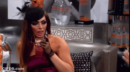 Woman In Purple Dress Holding Absolut Vodka GIF