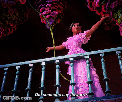 Woman In Purple Dress Holding Flowers Saying Did Someone Say Flowers GIF