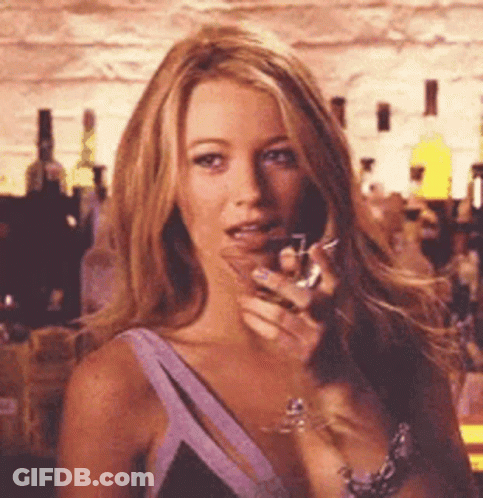 Woman In Purple Dress Holding Wine Glass GIF