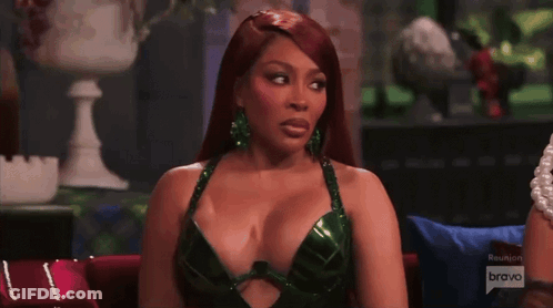 Woman In Purple Dress In Front Of Fireplace Real Housewives GIF