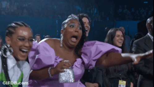 Woman In Purple Dress Laughing With Mouth Open GIF