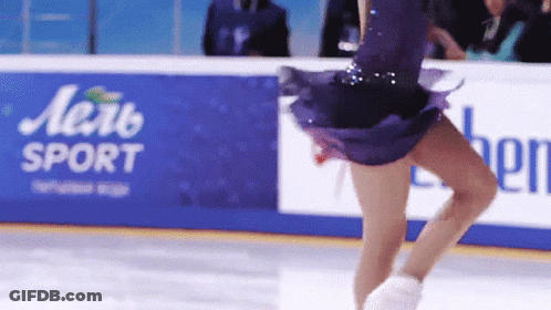 Woman In Purple Dress Skating In Front Of Aerb Sport Sign GIF