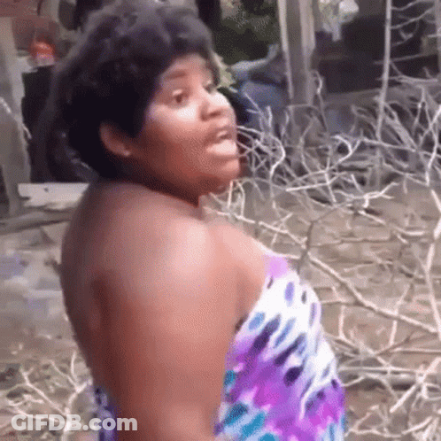 Woman In Purple Dress Standing Before Branches GIF