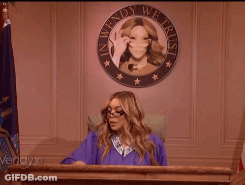 Woman In Purple Gown At Podium With Wendy We Trust Seal GIF