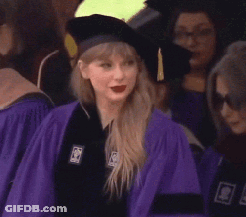 Woman In Purple Graduation Cap And Gown GIF