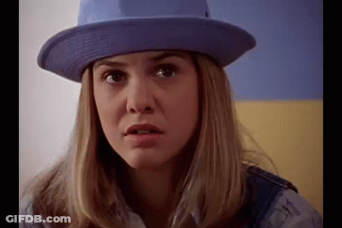 Woman In Purple Hat And Overalls GIF